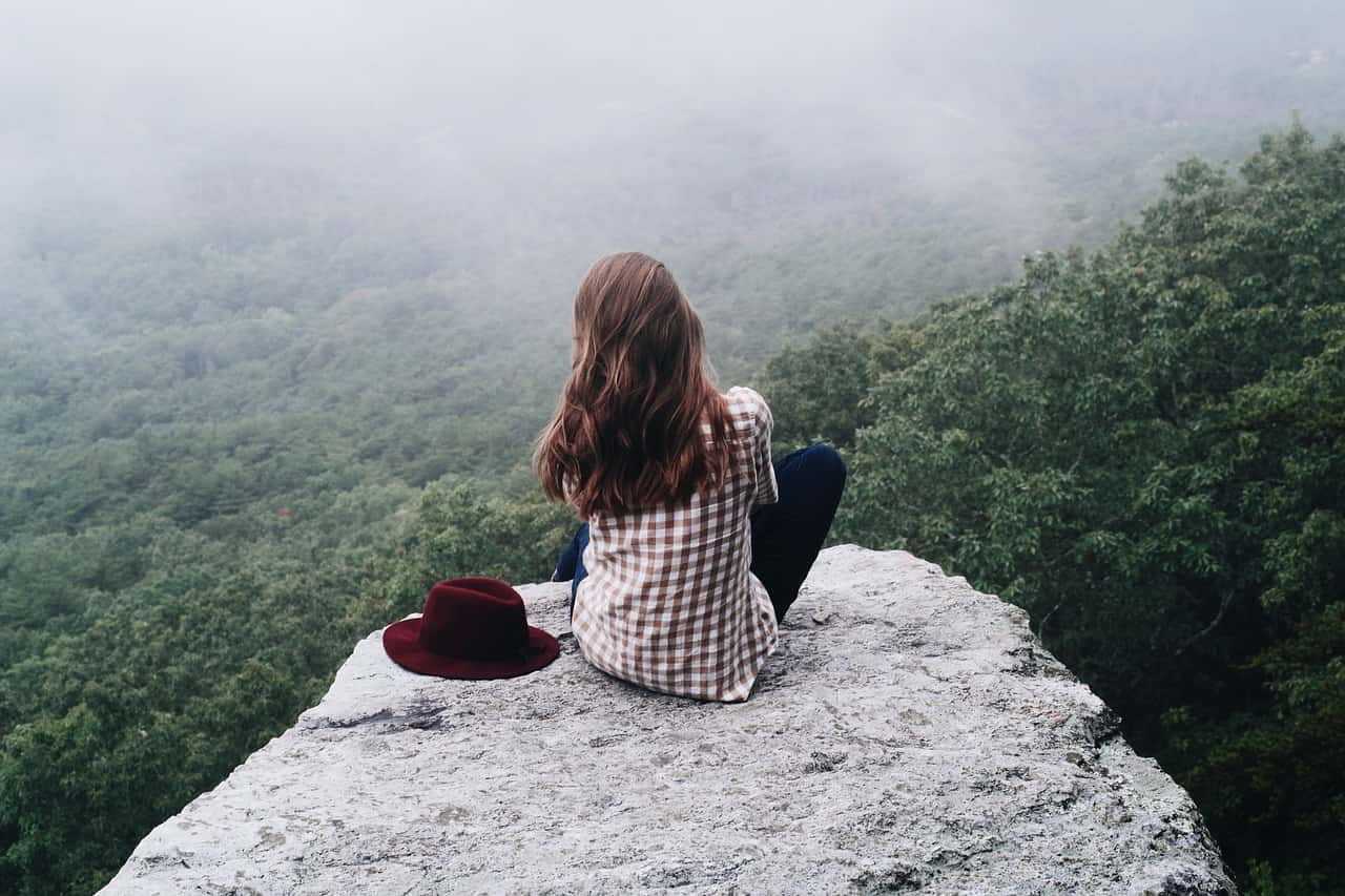 A person putting down their phone and enjoying nature or socializing in person