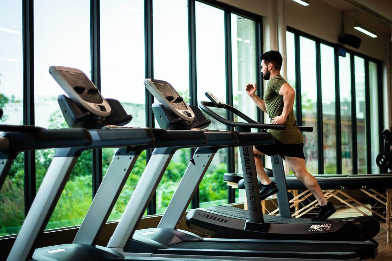 A photo of someone sprinting, ideally in an outdoor setting or on a treadmill.