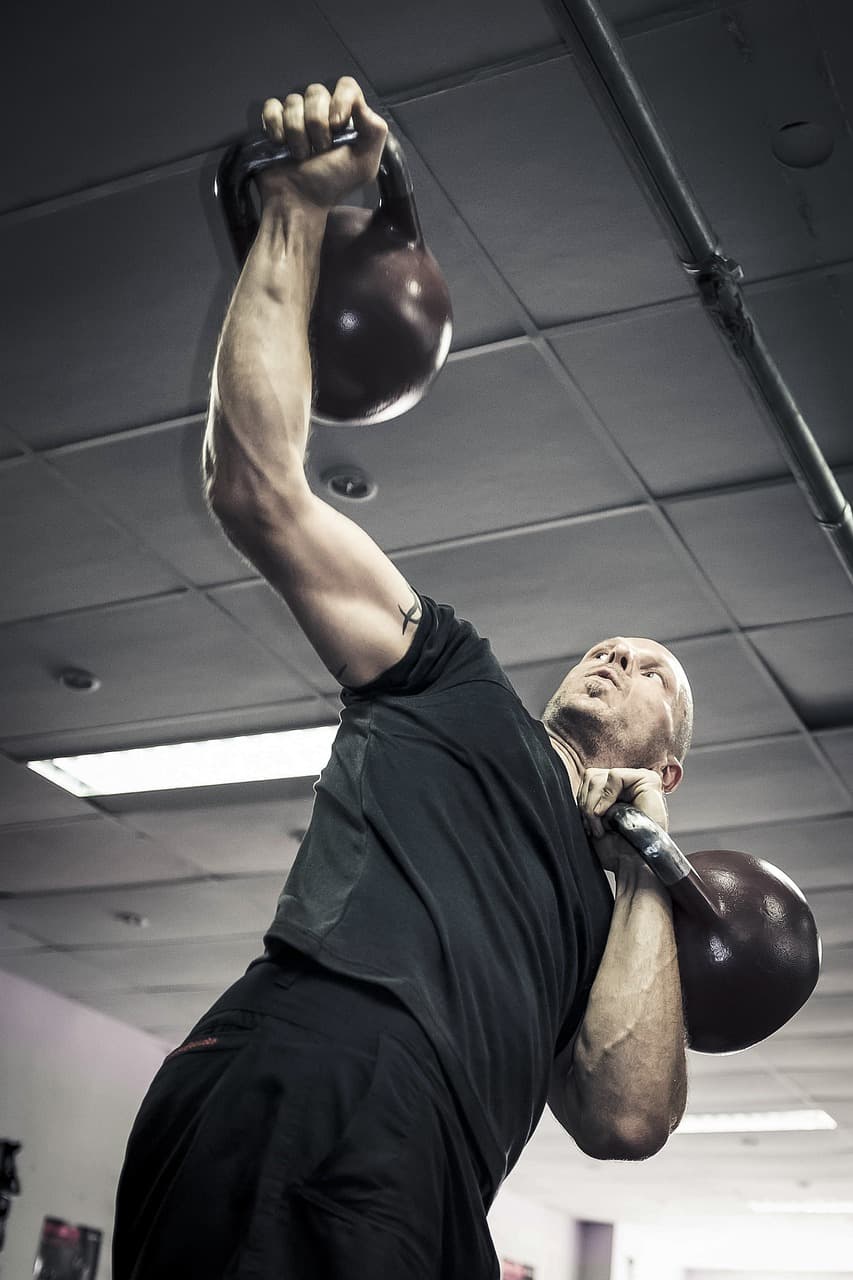 A photo of someone performing a kettlebell swing with proper form.