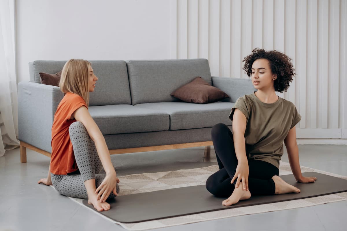 two people exercising together