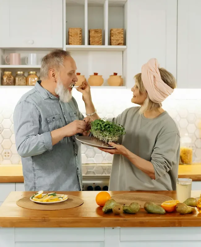 A happy woman enjoying a healthy salad bowl outdoors, representing a healthy lifestyle.